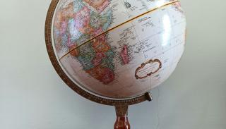 An image of a standing globe on a side table 